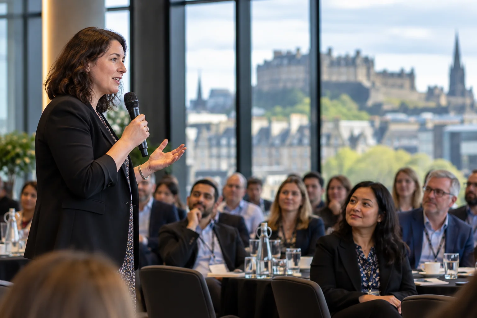 A speaker addressing conference attendees